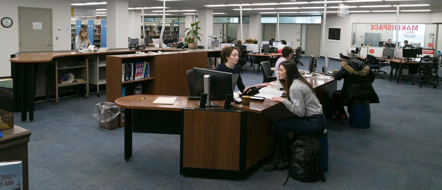 students seated at desks inside Kresge Library